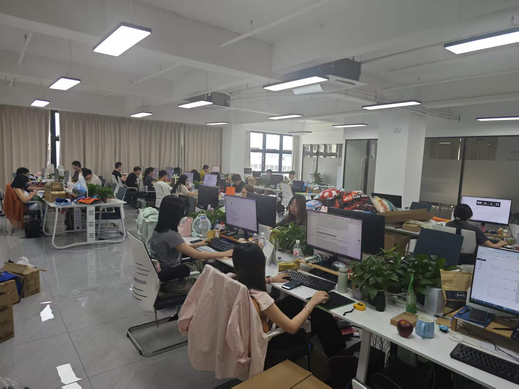 ZHONGHUI WildScope sales and sourcing team working at their desks in the Yiwu office