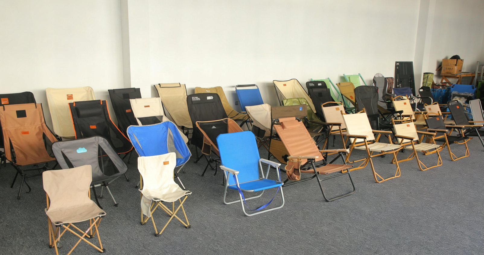 Rows of camping chair samples arranged in the ZHONGHUI WildScope showroom for buyer comparison